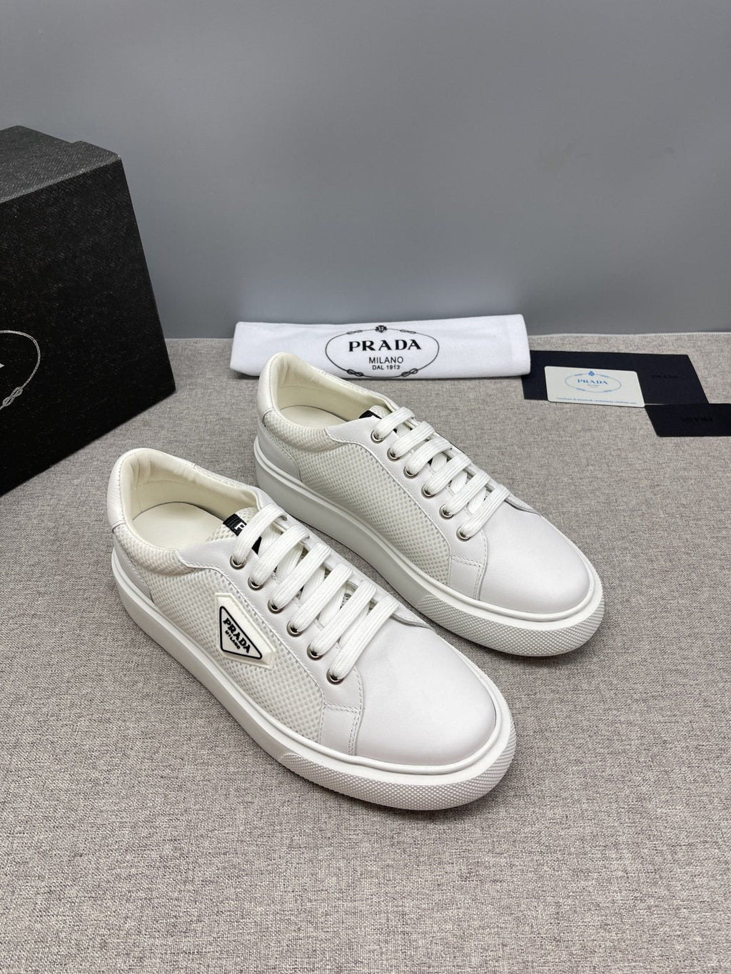 Prada Triangle Patch Low-Top Sneakers — front