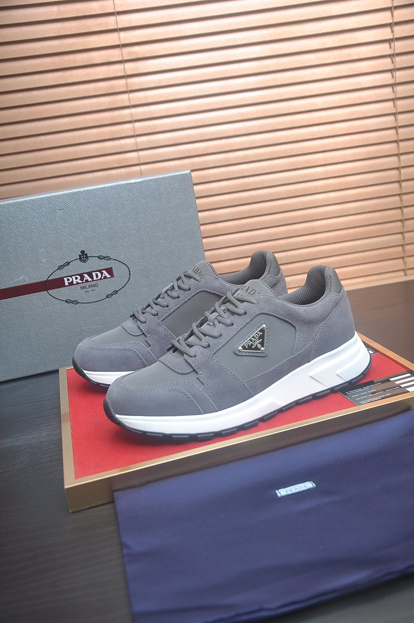 Prada Triangle Plaque Low-Top Sneakers — front